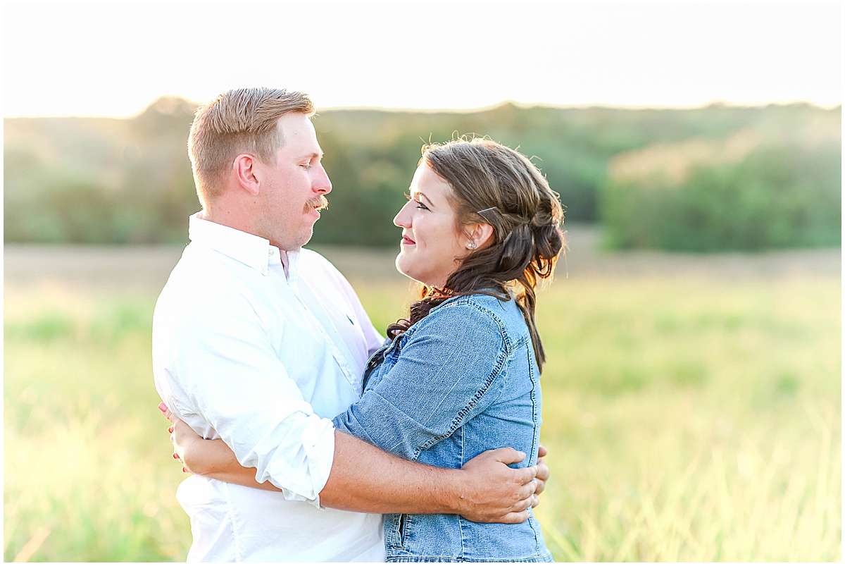 couple in field during engagement session in north alabama