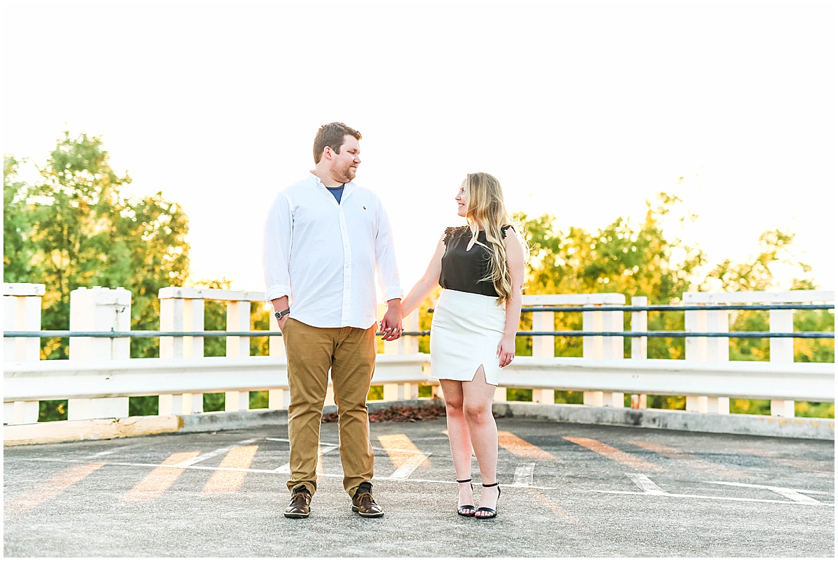 couple standing on parking garage in downtown huntsville engagement session