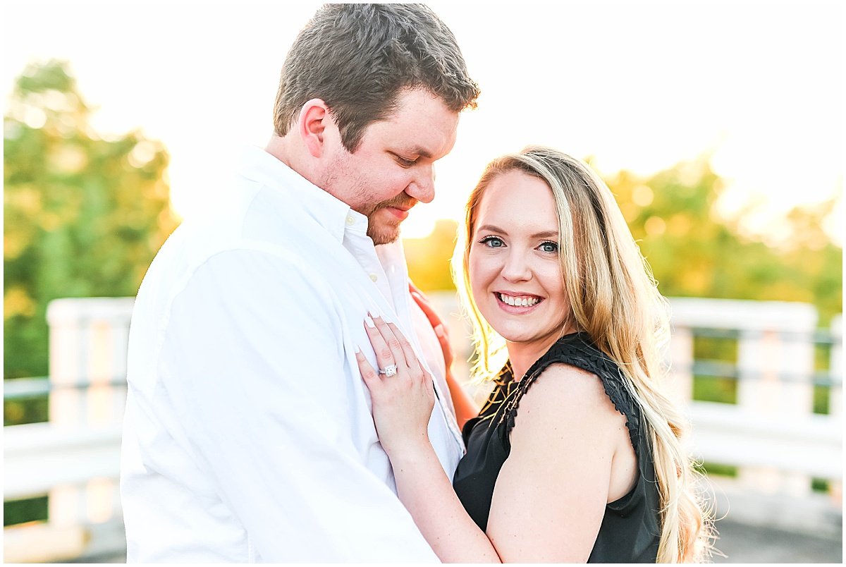 couple smiling during engagement session downtown huntsville